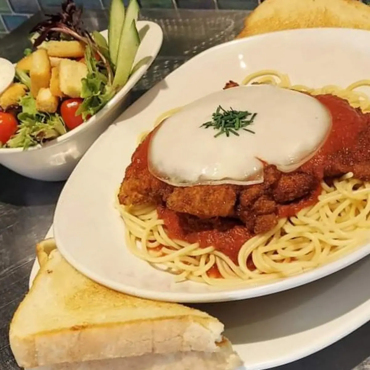 Chicken Parmesan over Spaghetti