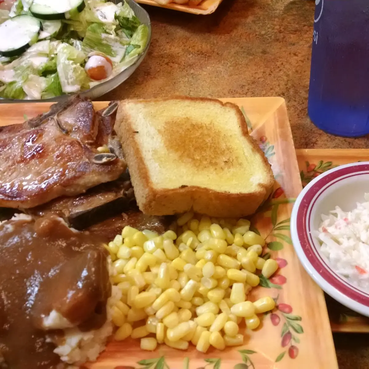 Pork Chops with Mashed Potatoes and Gravy Corn Coleslaw and Texas Toast