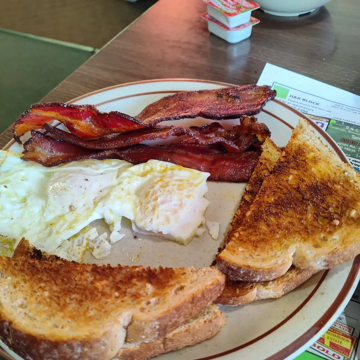 Two Eggs over Medium w Bacon & Wheat Toast