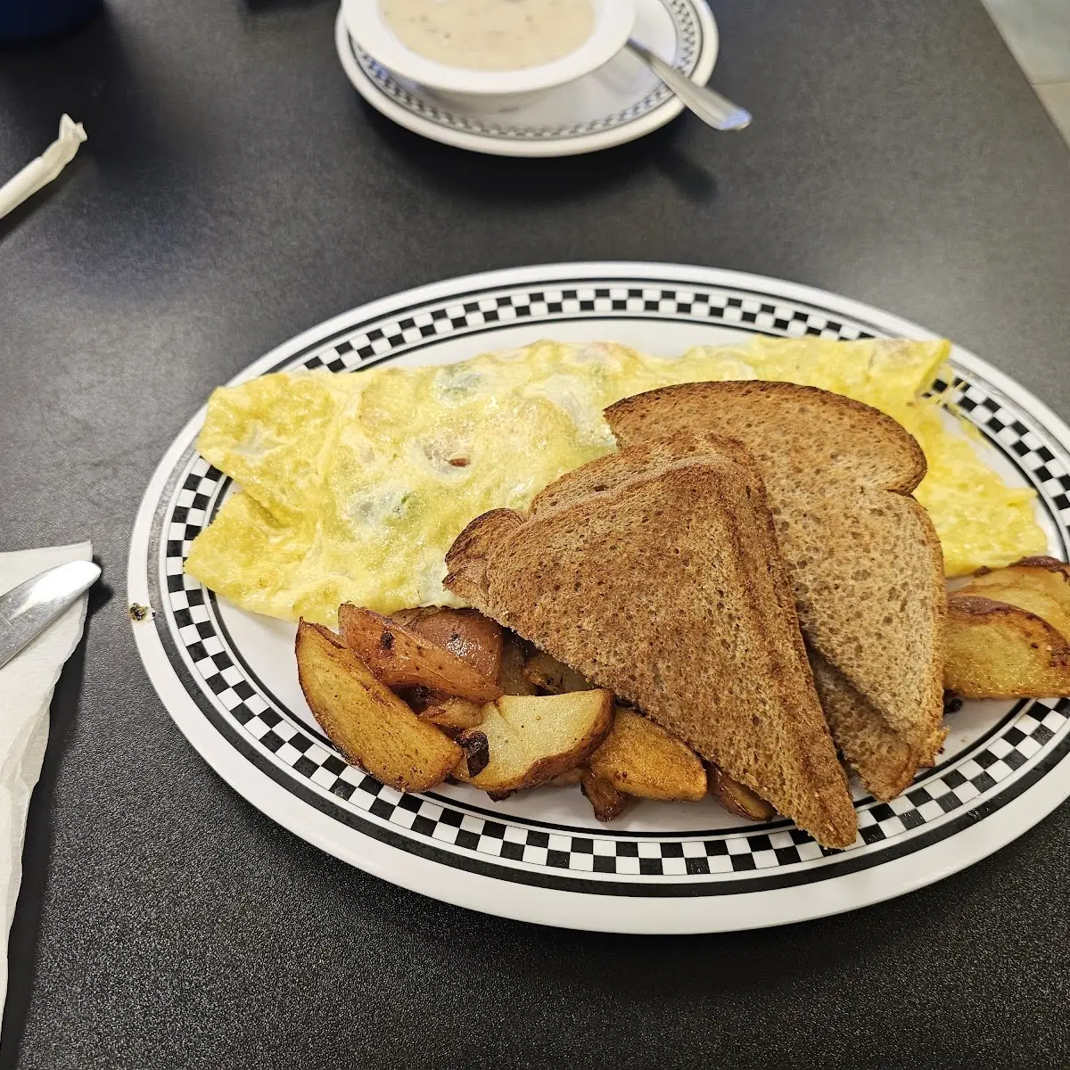 Eggs Benedict with Corned Beef Eggs Home Fries and Sausage Gravy