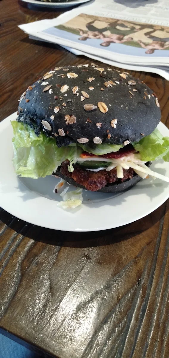 Schnitzel Roll with Charcoal Bun, Capel Bake & Café