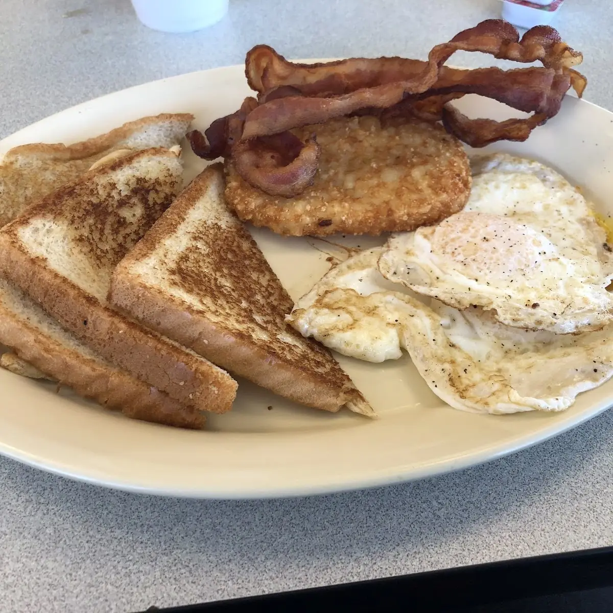 Two Eggs Hash Browns Toast and Jelly