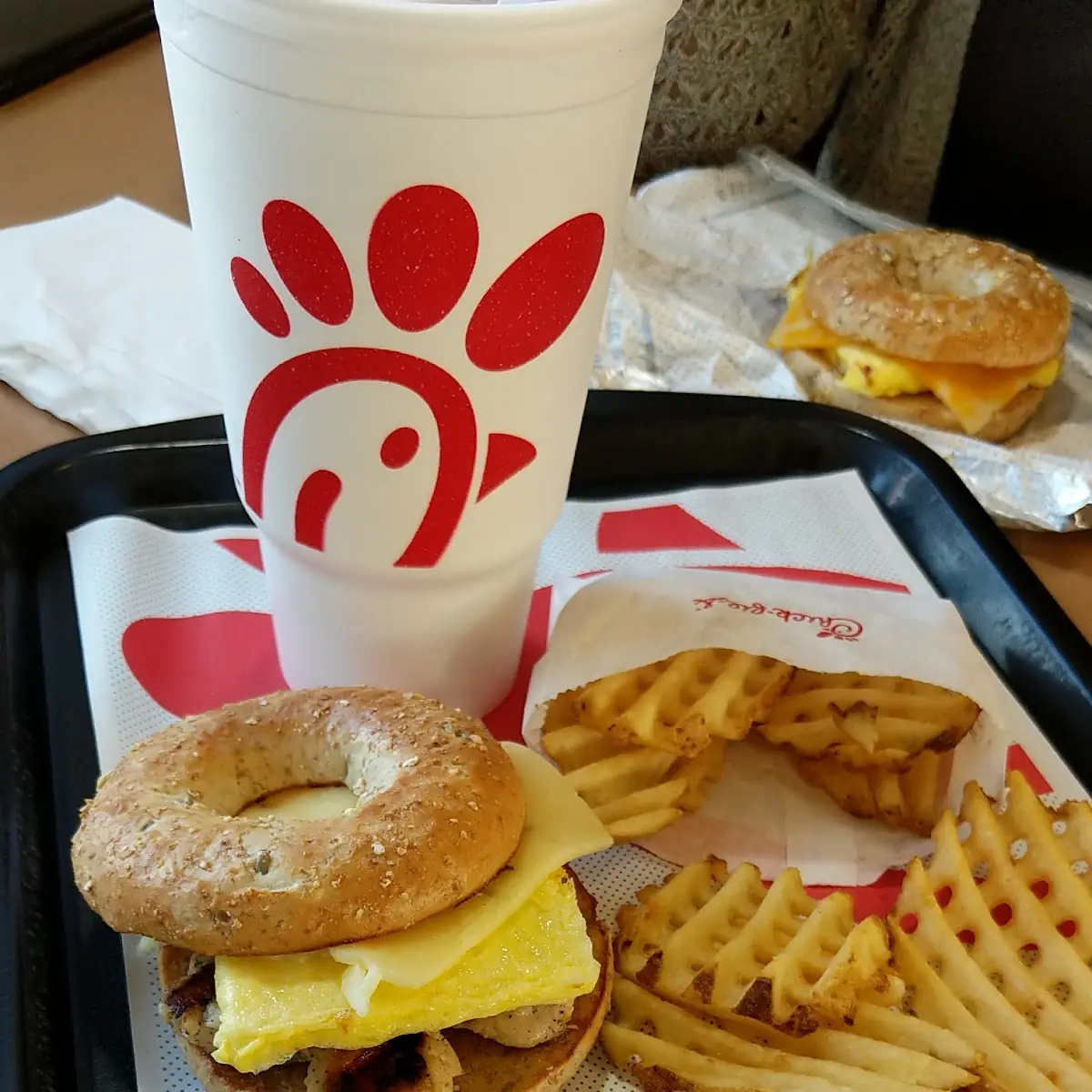 Multi Grain Bagel with Grilled Chicken Egg & Pepper Jack Cheese Along with Waffle Fries