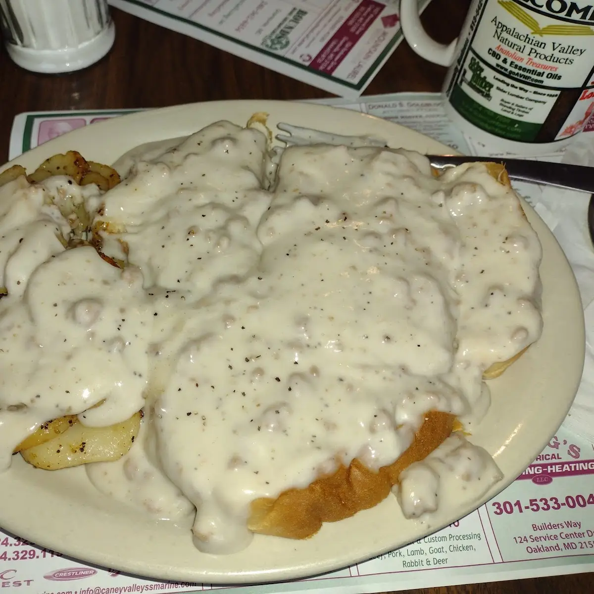 Sausage Gravy over Bread and Sliced Fried Potatoes