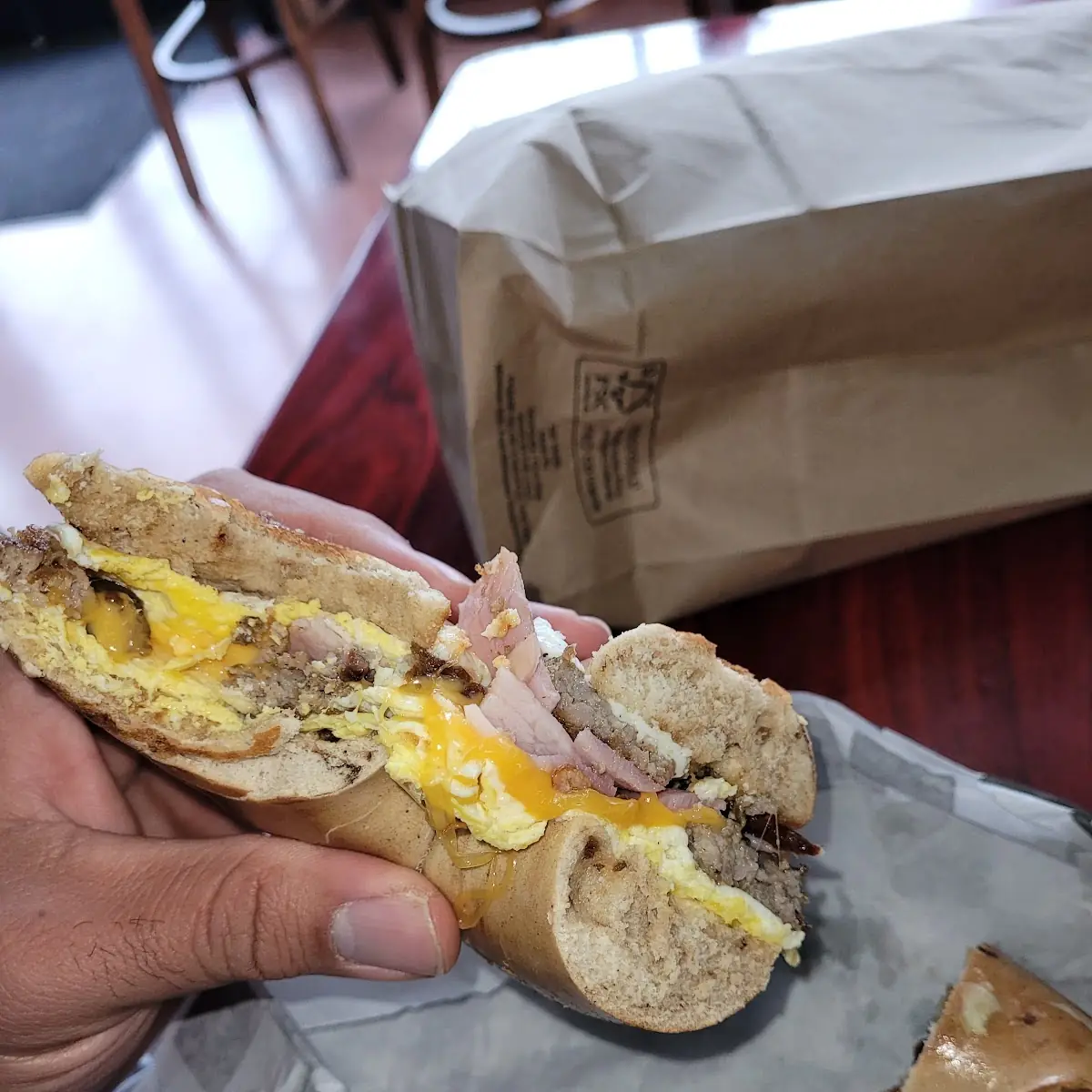 Sausage Egg Cheddar Ham Bacon on Cinnamon Raisin Bagel