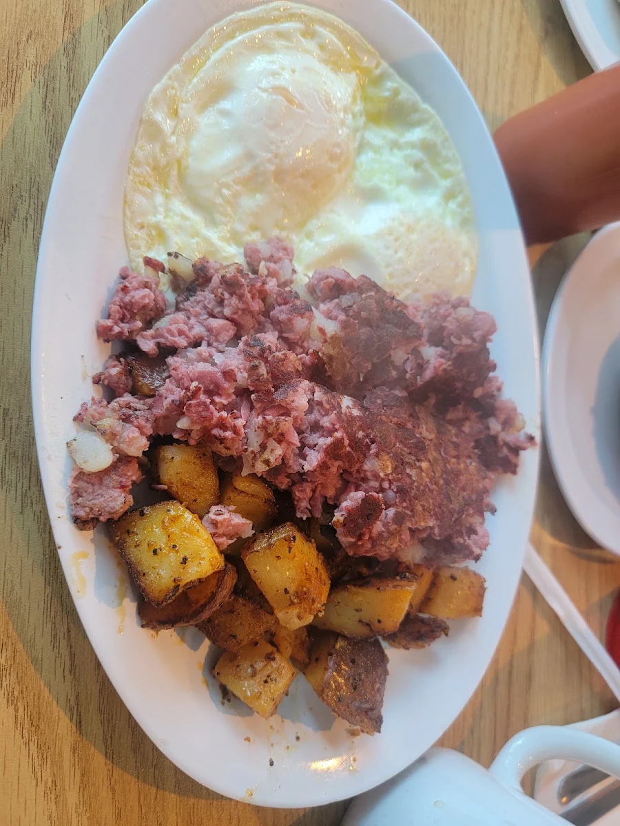 2 Eggs with Bagel & Butter with Corned Beef Hash & Home Fries or Grits