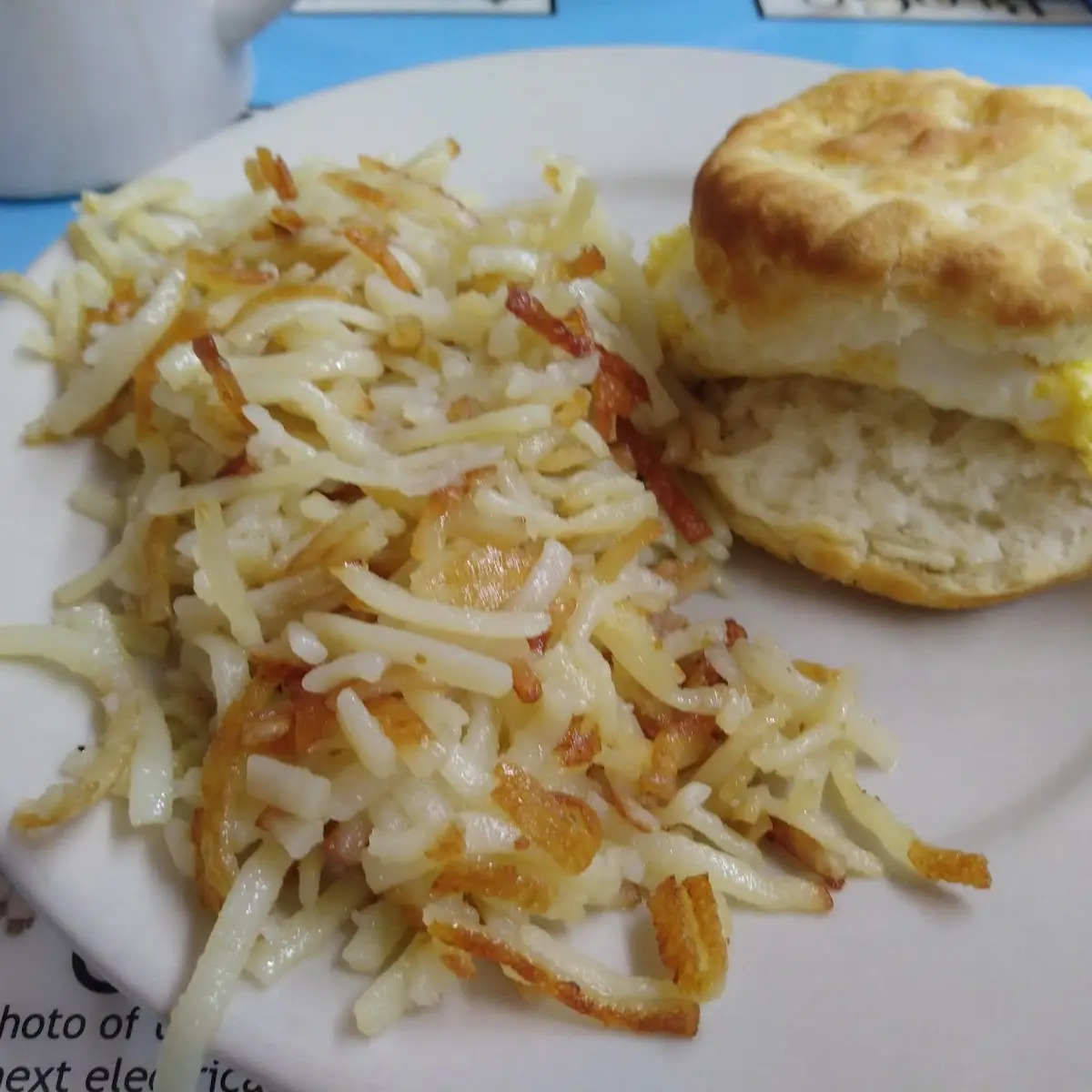 1 Egg Breakfast with Grits Hash Browns and Biscuits