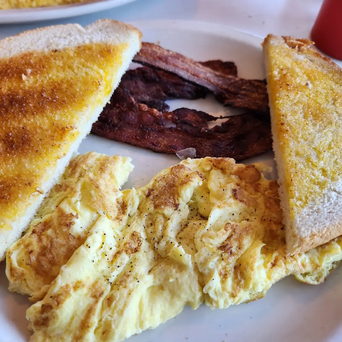 Corned Beef Hash Two Eggs over Easy Hashbrowns and Housemade Rye Toast