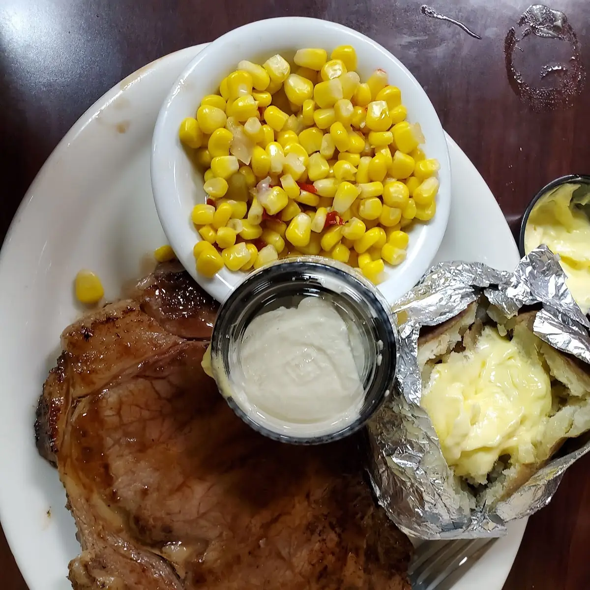 Prime Rib with Baked Potato and Corn