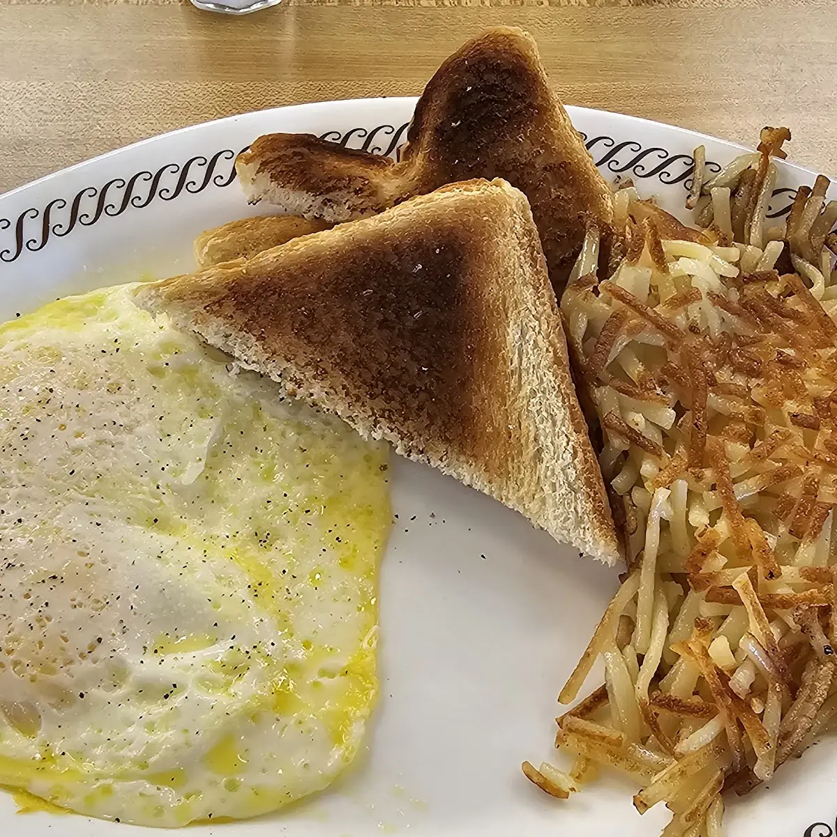 Two Eggs over Easy Toast and Hash Browns