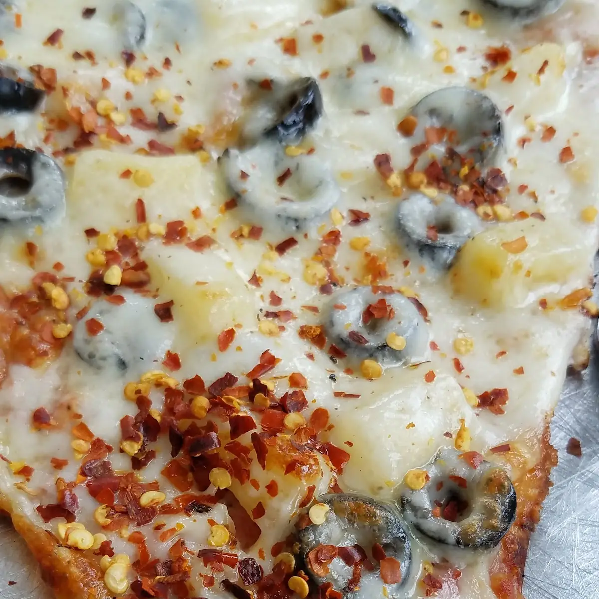 Pineapple Black Olive Pizza Slice