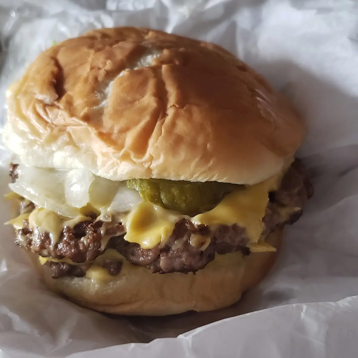 Triple Cheeseburger with Added Lettuce Onions Pickles and Mayo