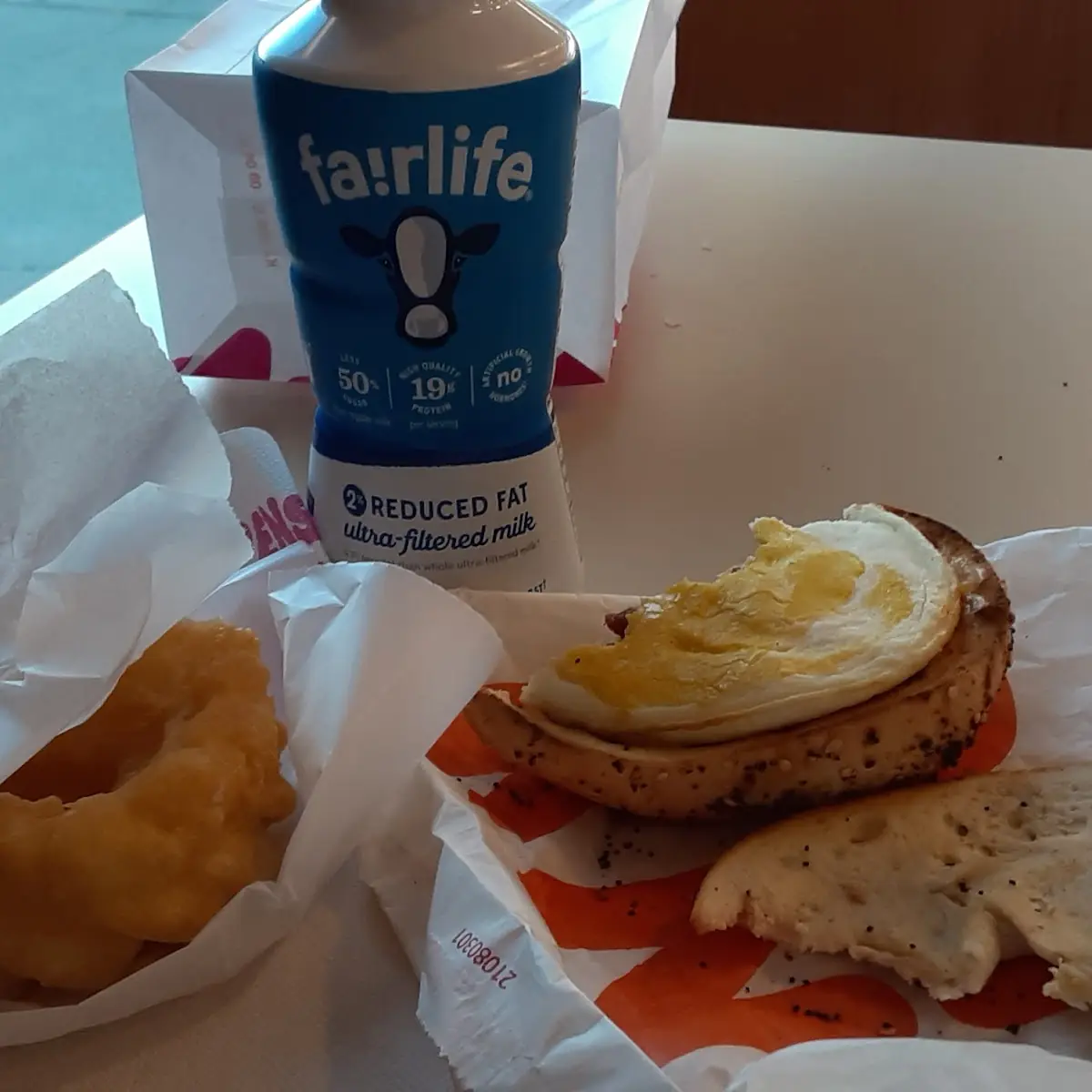 Everything Bagel with Bacon Egg and Cheese and Kruler Donut