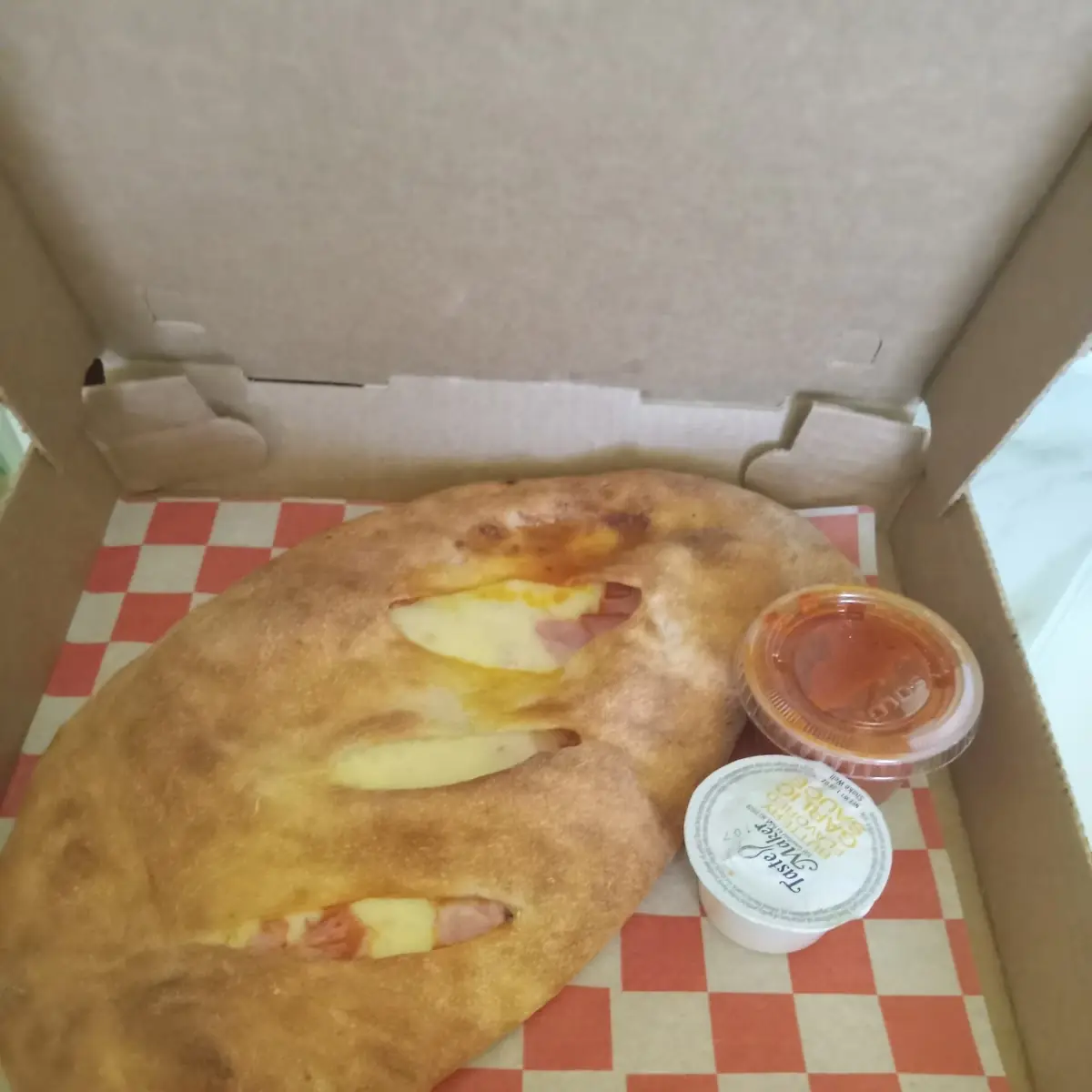 Stromboli with Pepperoni Ham Cheese and Marinara