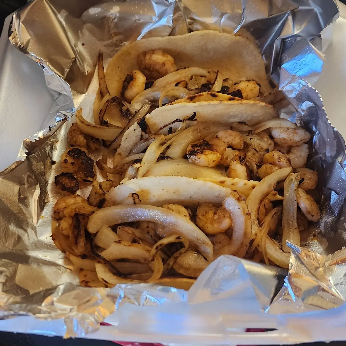 3 Shrimp Tacos with Grilled Onions