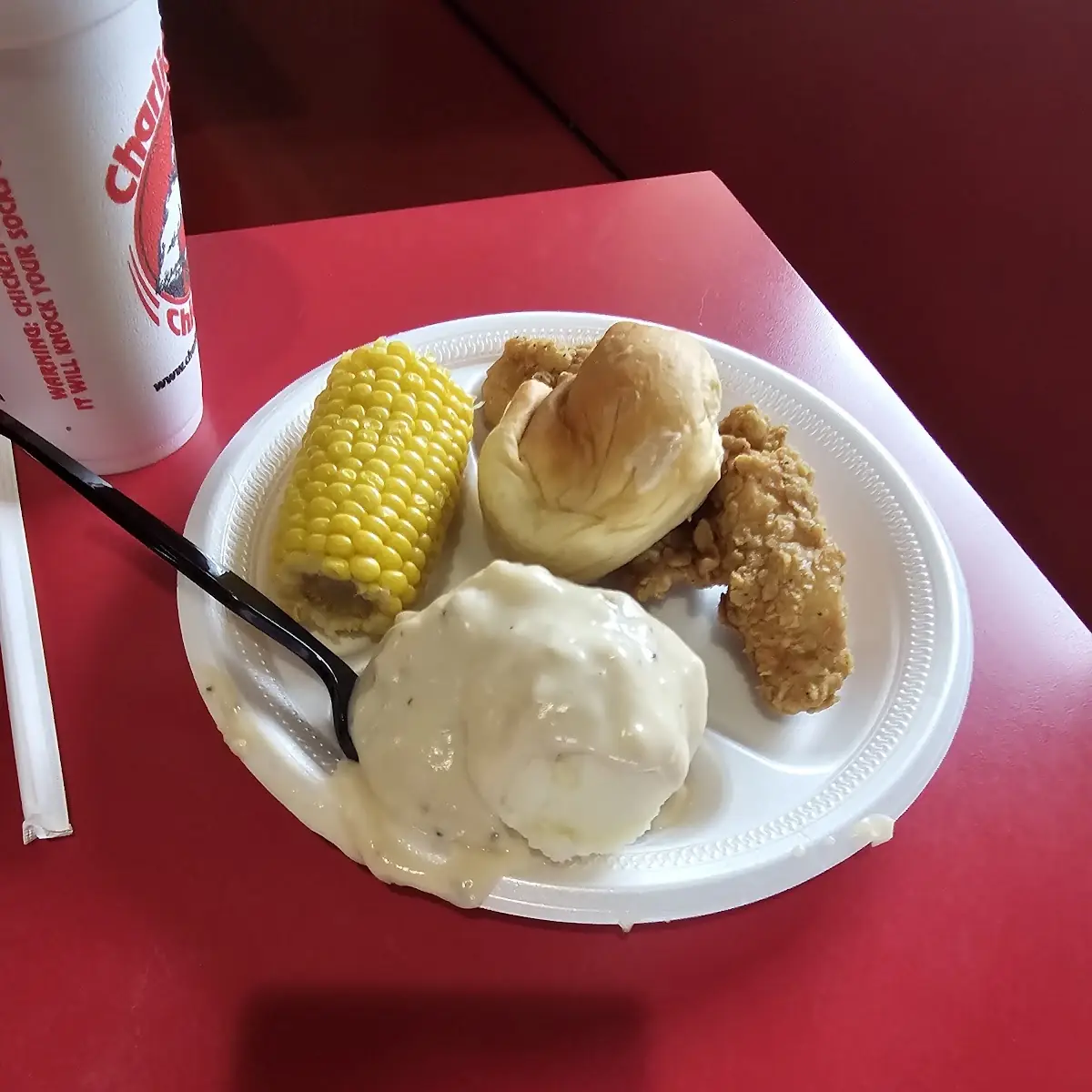 Chicken Chunks Mashed Potatoes with Gravy Corn on Cob and Roll