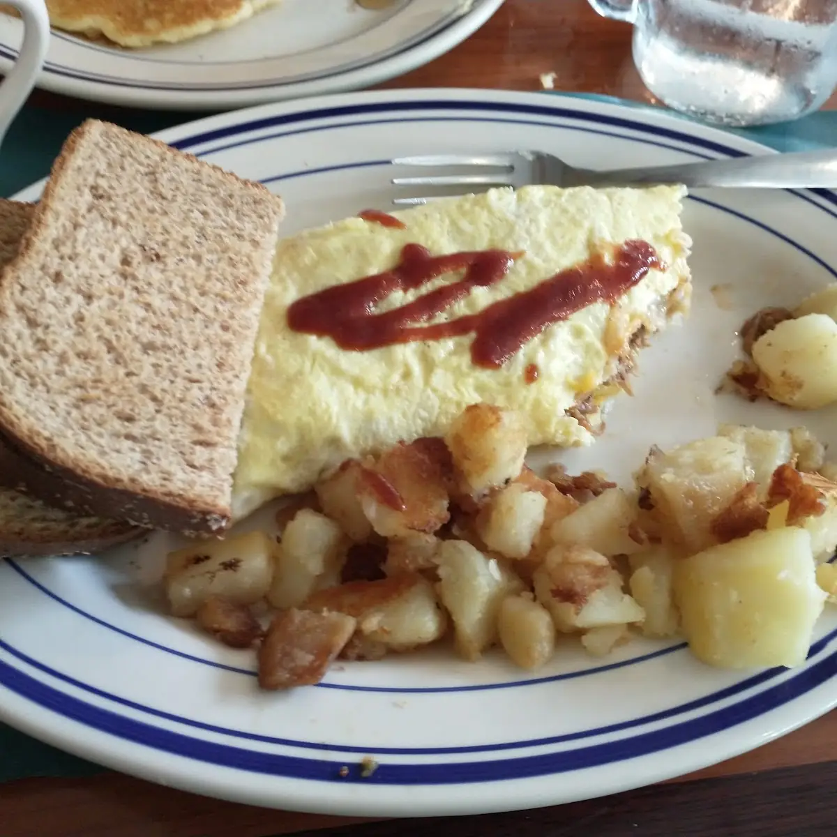 Bacon Cheeseburger Omelette with Potatoes and Toast