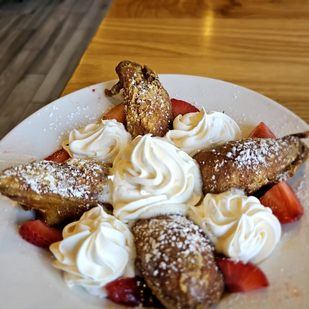 Vicious Beignets Stuffed with Cinnamon Cream Cheese with Strawberries and Whipped Cream