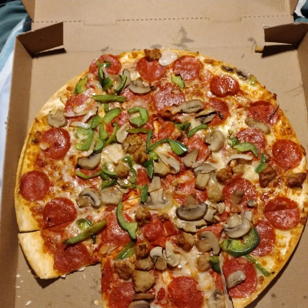 A Large Thin Crust Superim Pizza