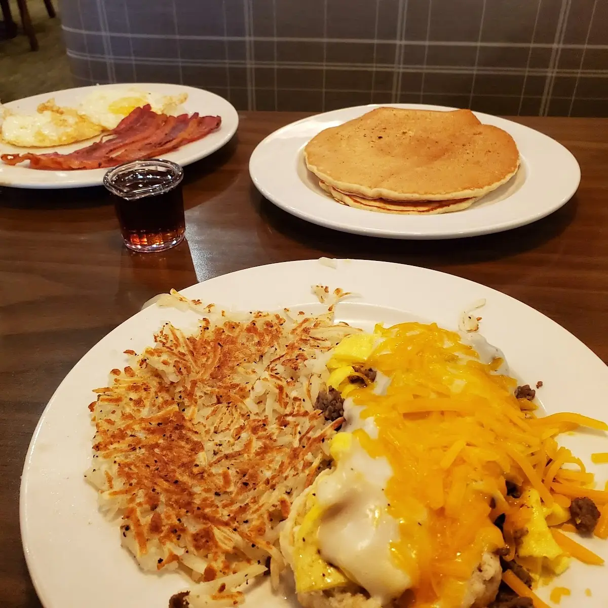 Biscuits and Gravy with Egg and Cheddar Cheese with Pancakes Eggs and Bacon