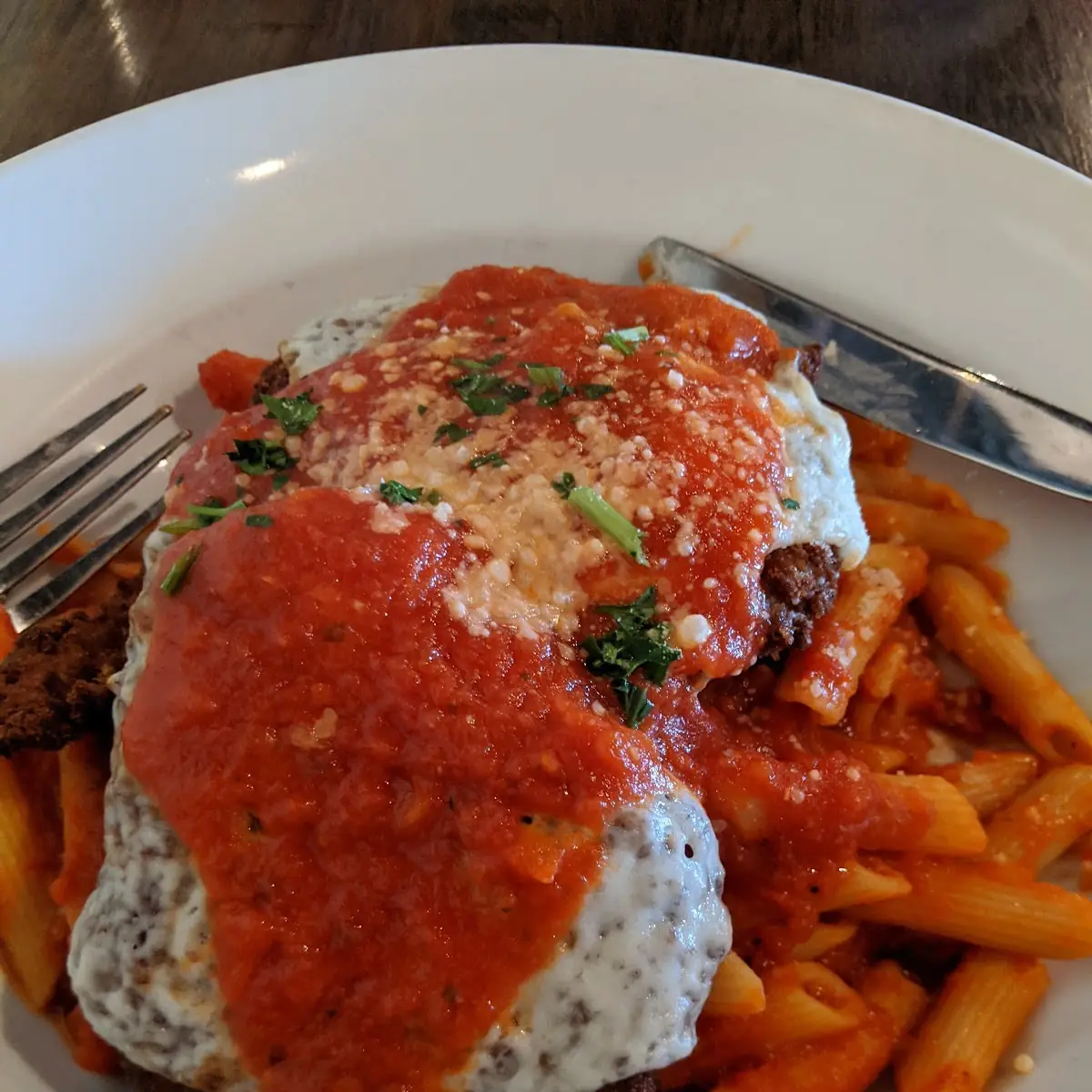 Chicken Parmigiana over Pasta