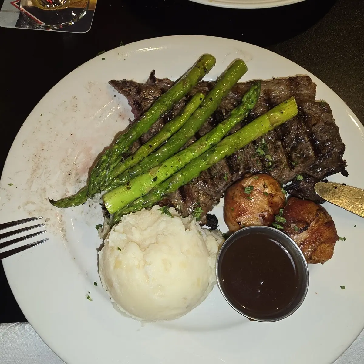 Hand Cut Ribeye with Scallops Wrapped in Bacon