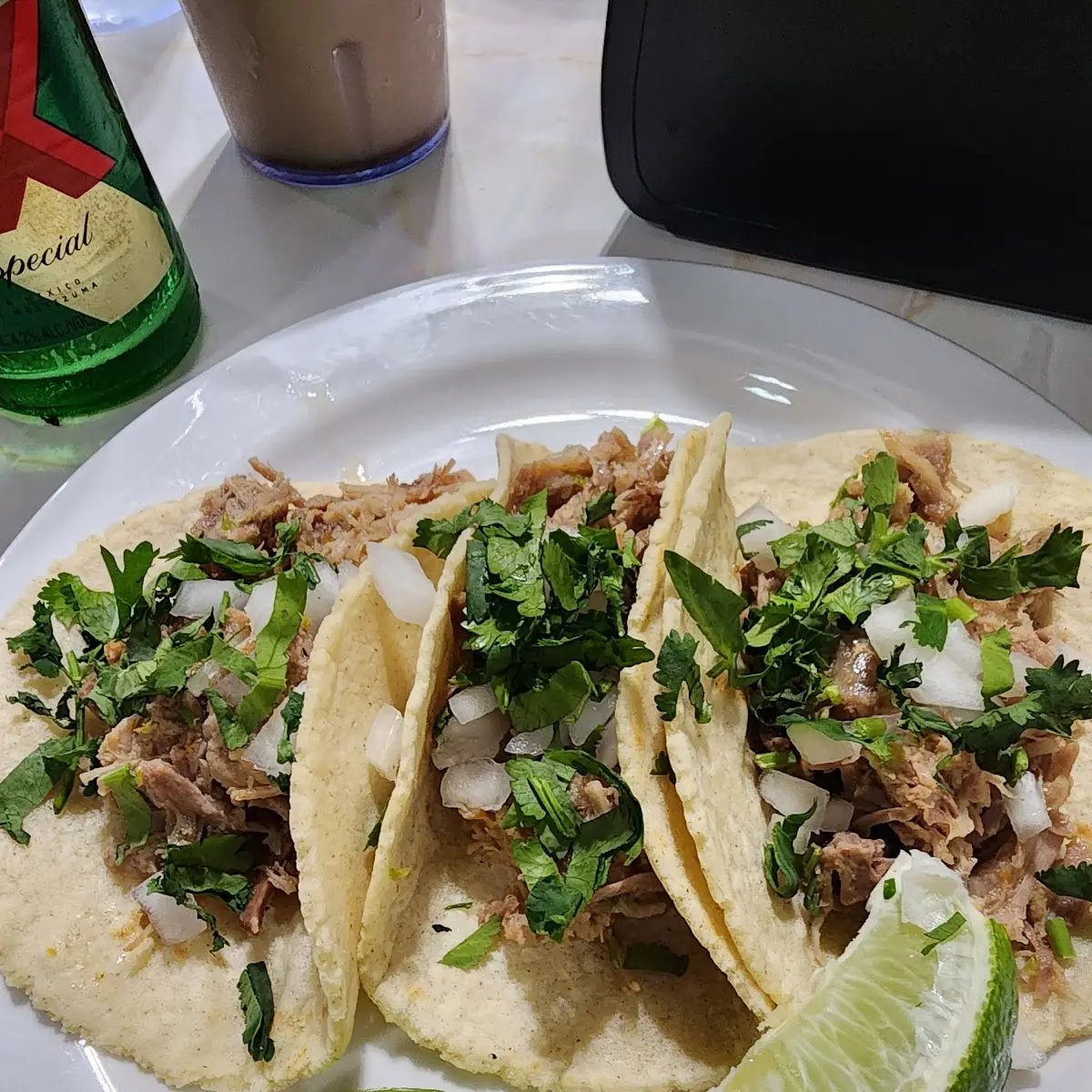 Pulled Pork Tacos Served on Fresh Homemade Corn Tortilla