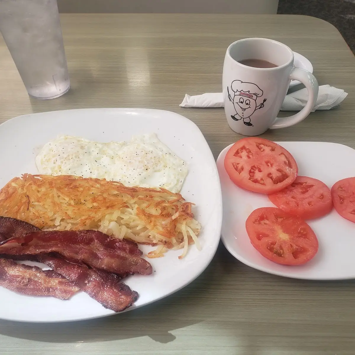 Eggs Smoked Bacon Hash Browns and Fresh Tomatoes