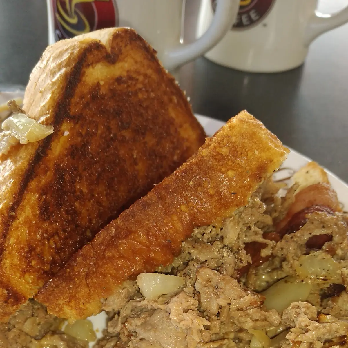 Double Bacon Cheesesteak Sandwich Melt with Double Smotherd Covered Hash Browns