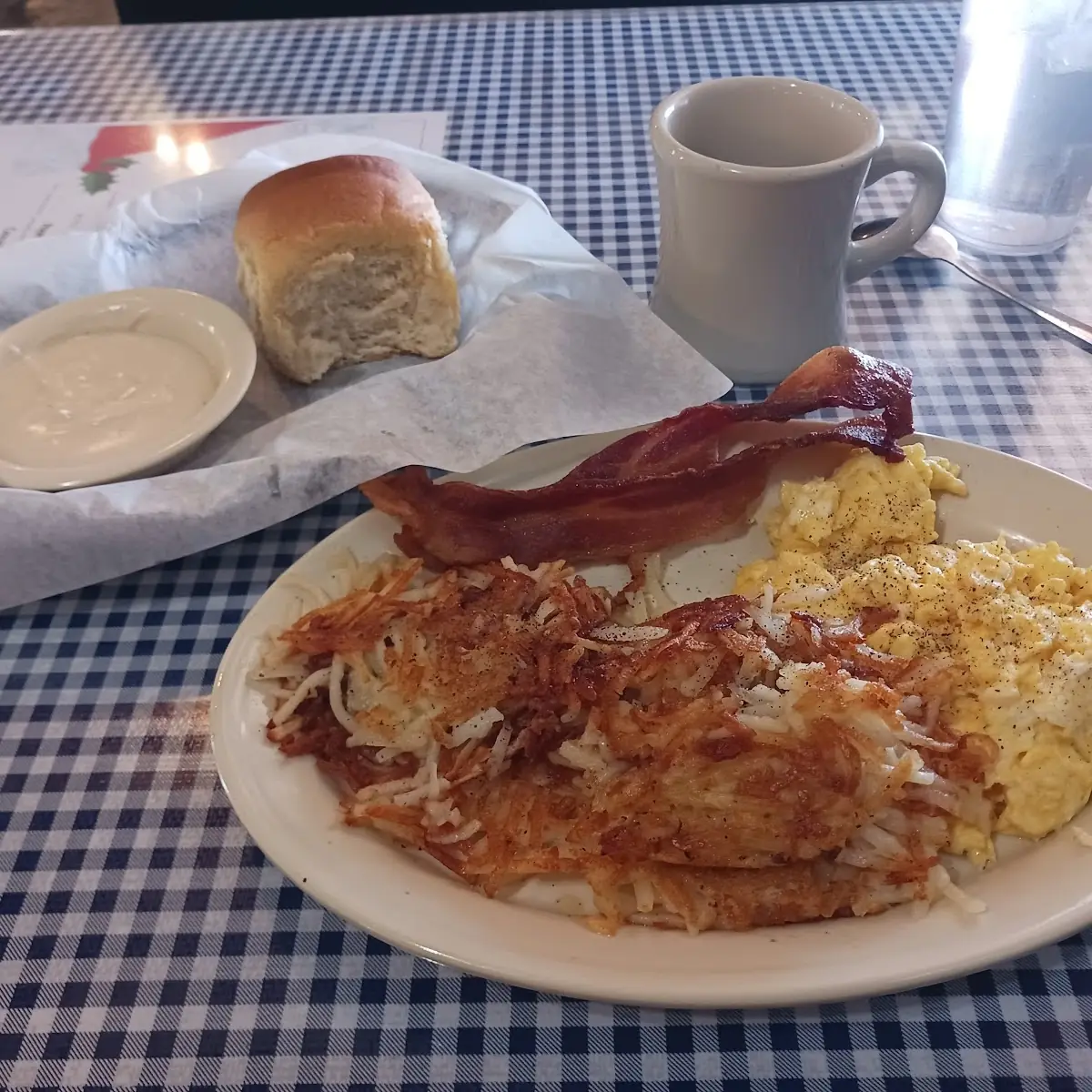 Scrambled Eggs Bacon Hash Browns Biscuits and Gravy