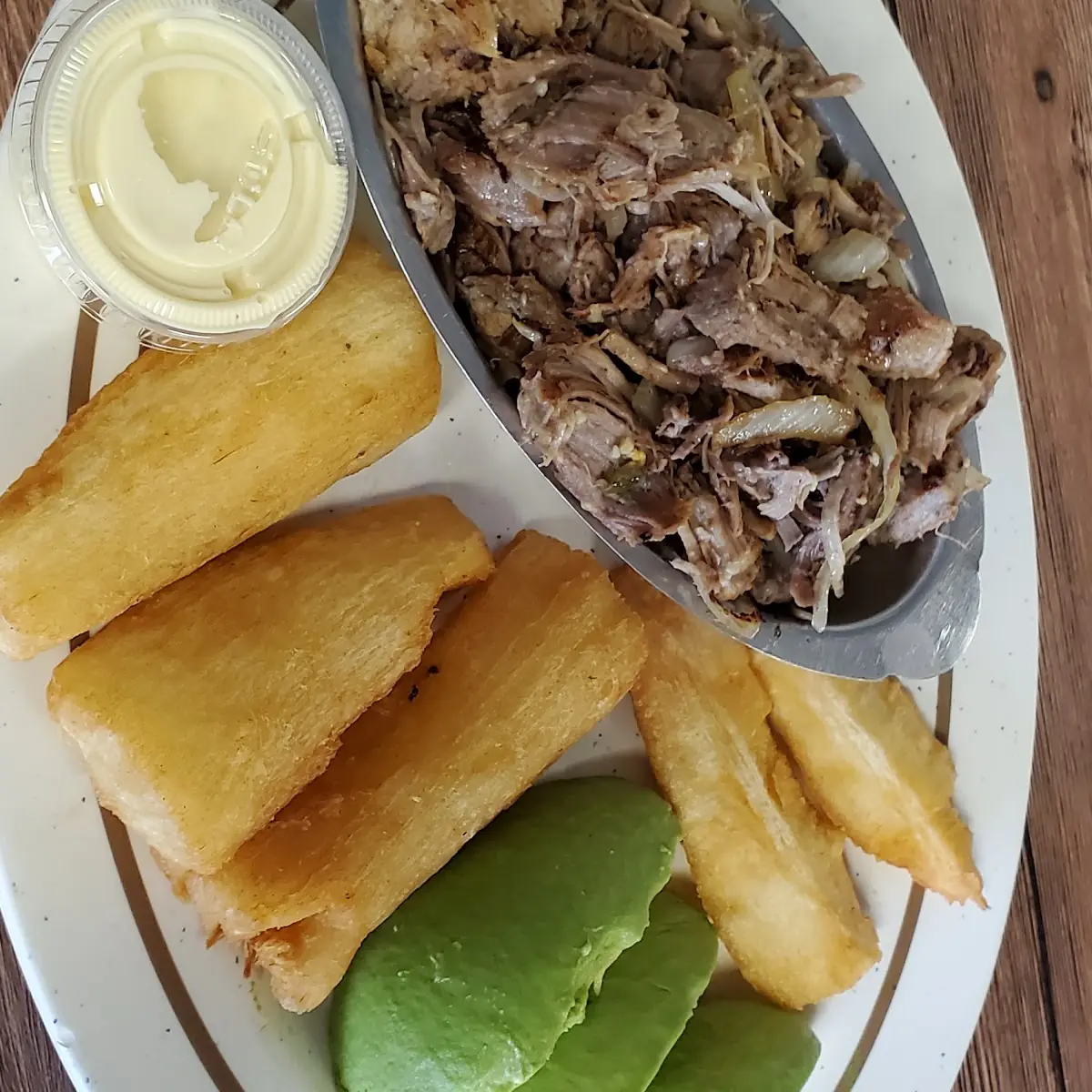 Lechón Asado Con Fried Yucca Y Avocado