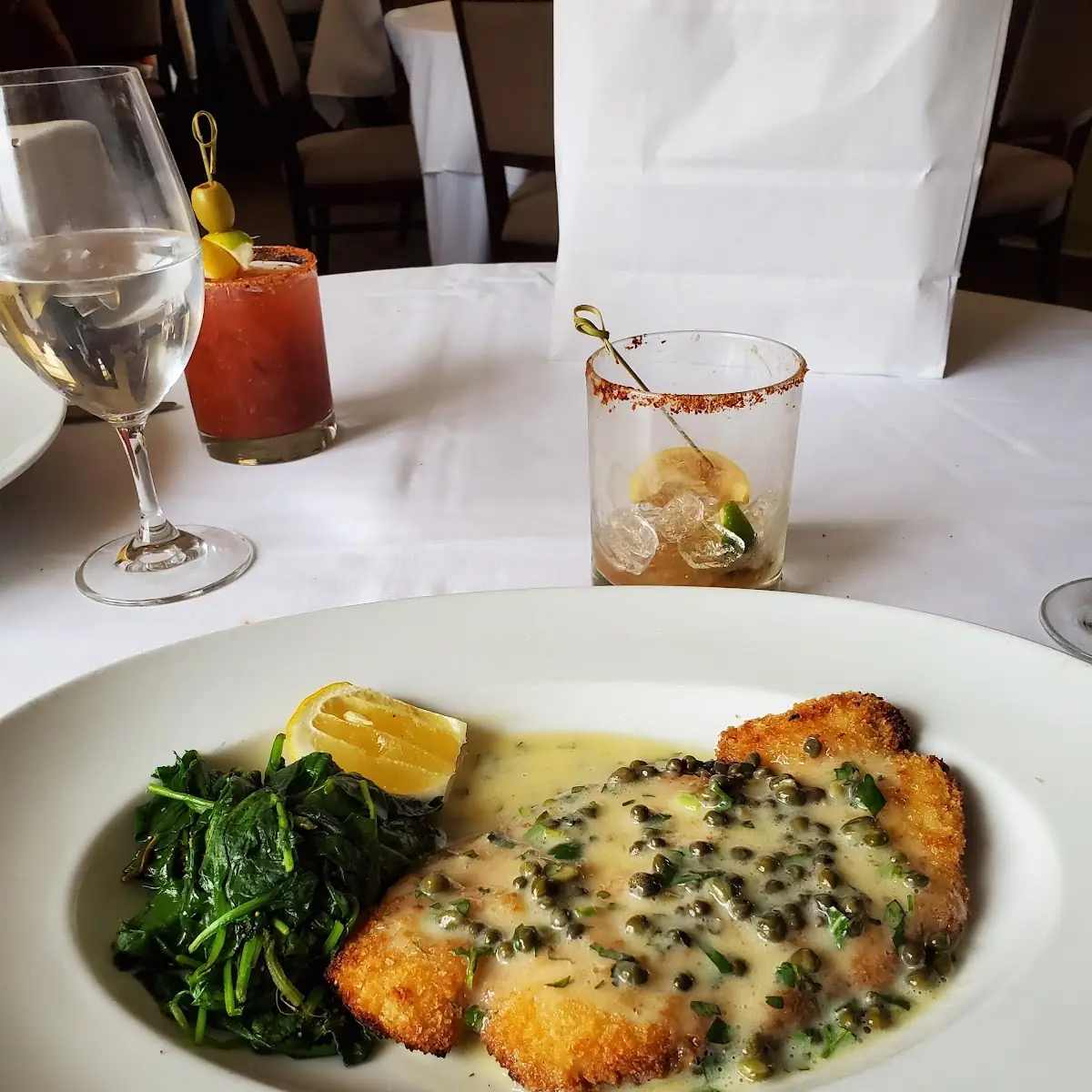 Chicken Schnitzel Capers Parsley Lemon & Sautéed Spinach
