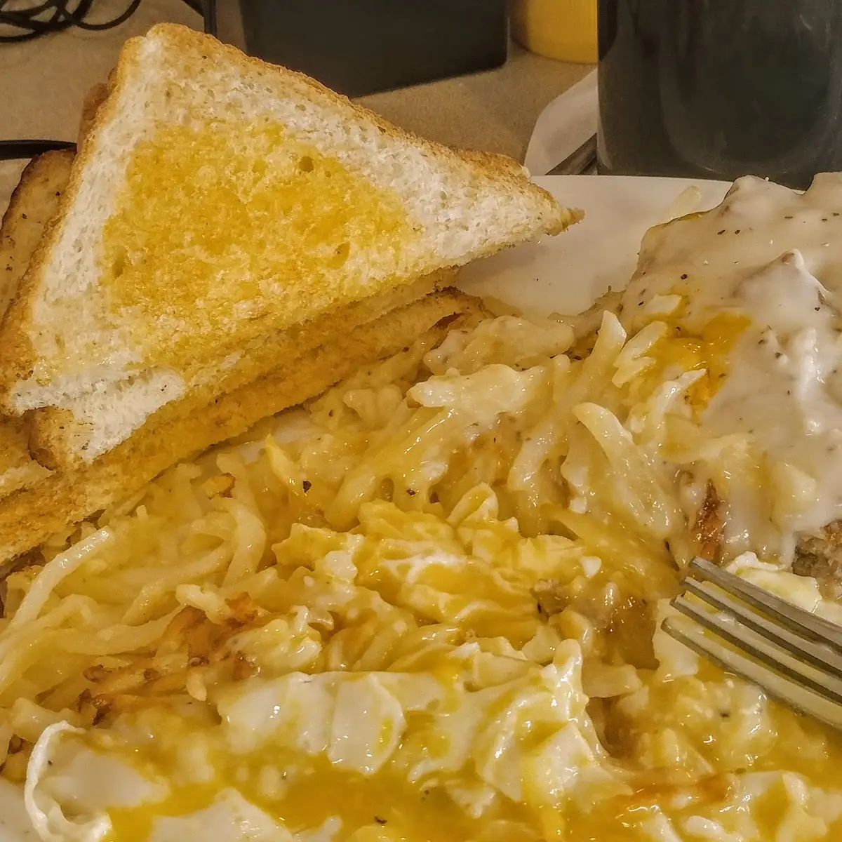Breakfast Chicken Fried Steak and Eggs Eggs over Medium Sausage Gravy Toast