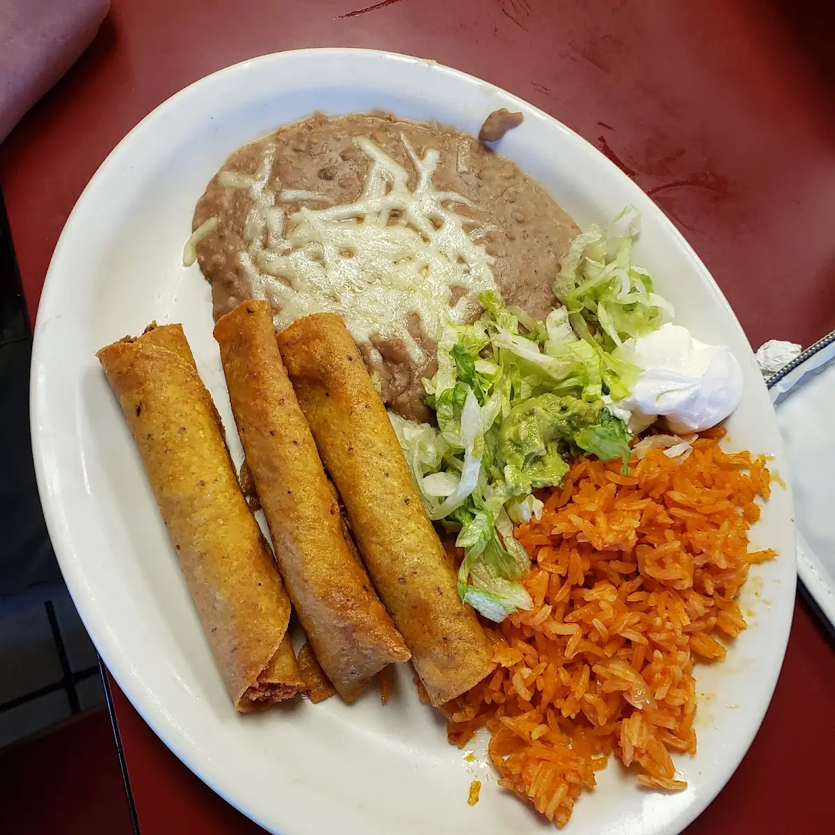 Enchiladas with Refried Beans and Rice