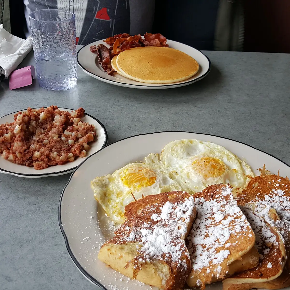French Toast Deluxe with Ham Bacon or Sausage & Two Eggs