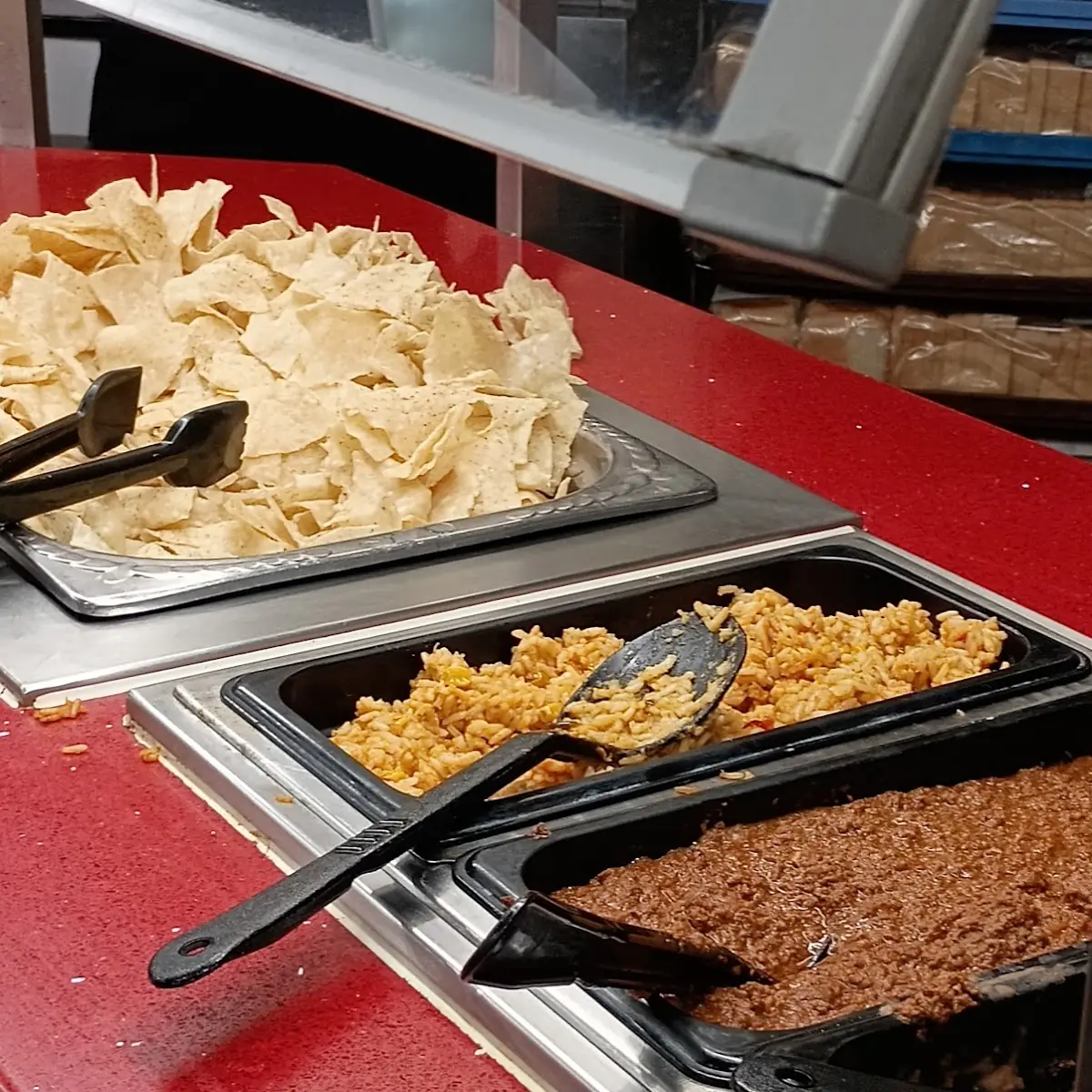 Fresh Cheese Enchiladas Pinto Beans Melted Cheddar Cheese and Deep Fried Corn Tortilla Chips