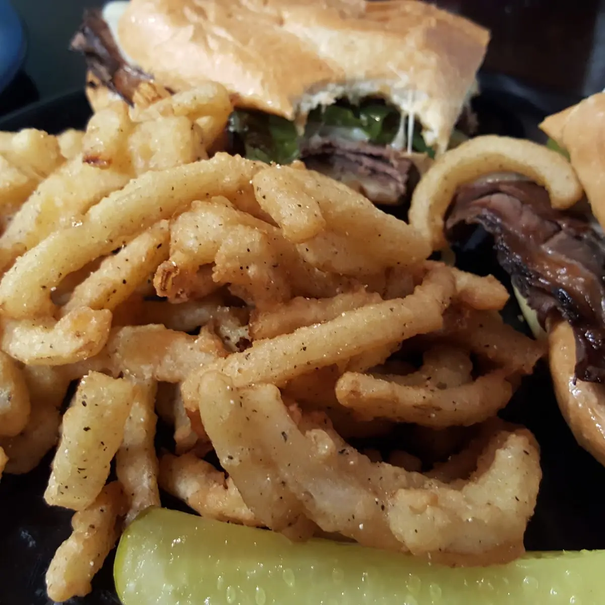 Philly Cheese Steak Sandwich and Onion Strings