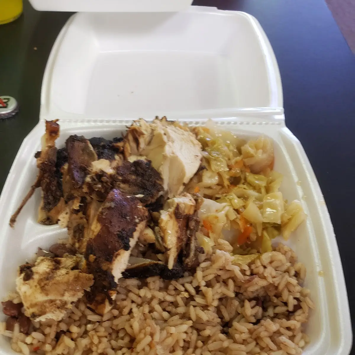 Ox Tail with Jerk Chicken and Cabbage