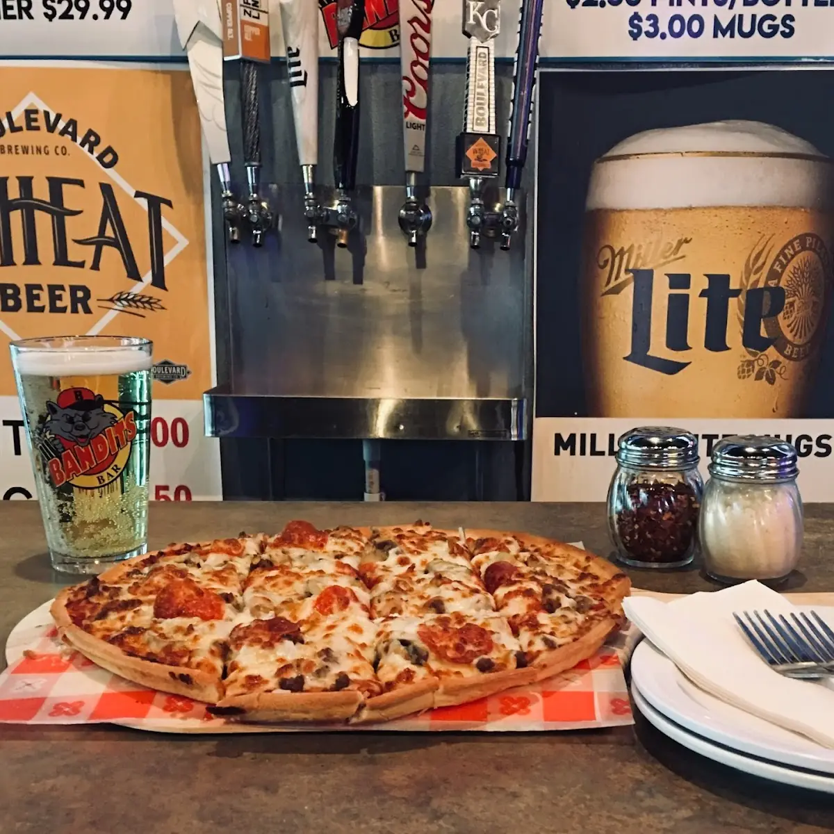 Pizza 12 Wings and Domestic Pitcher