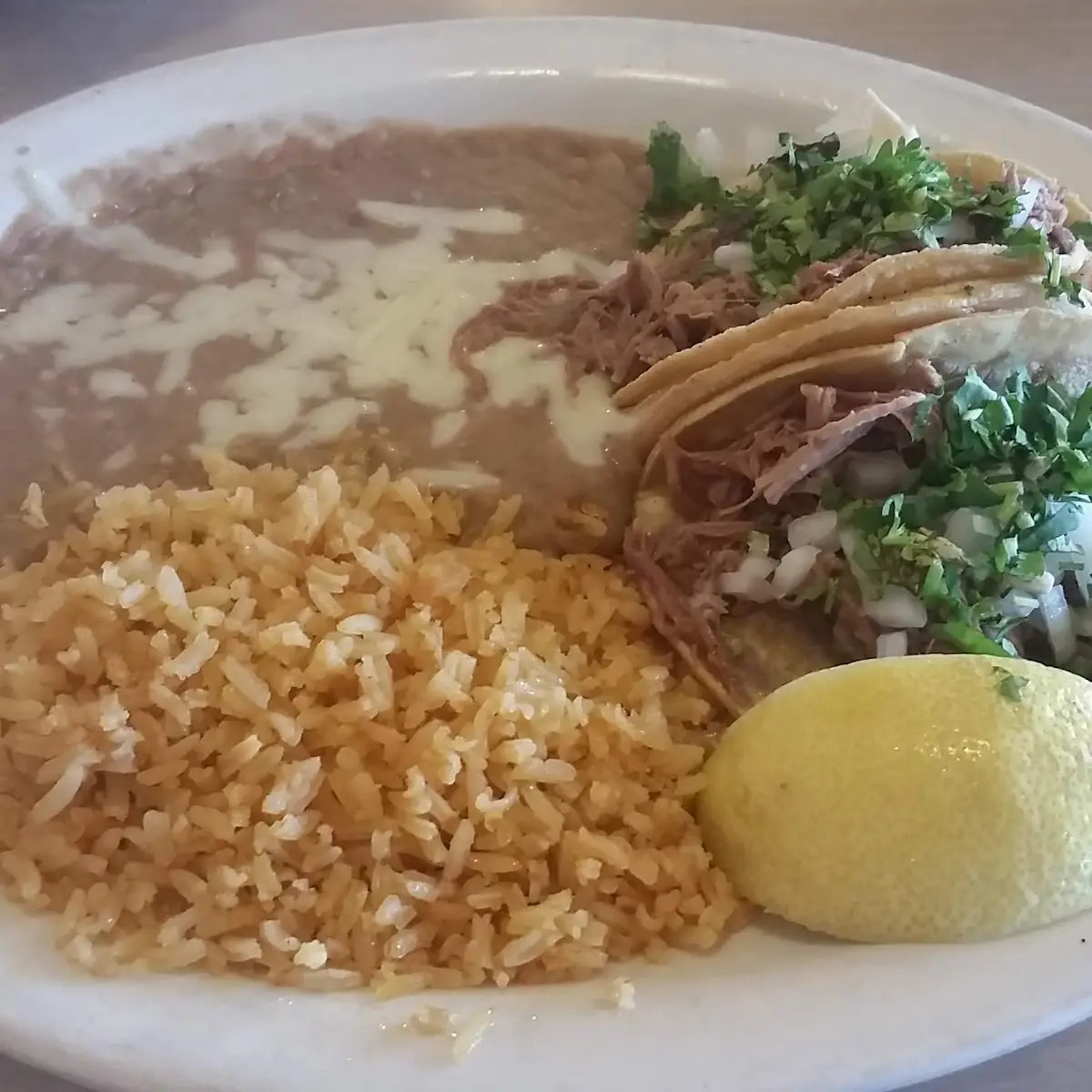 Shredded Beef Tacos with Rice and Refried Beans