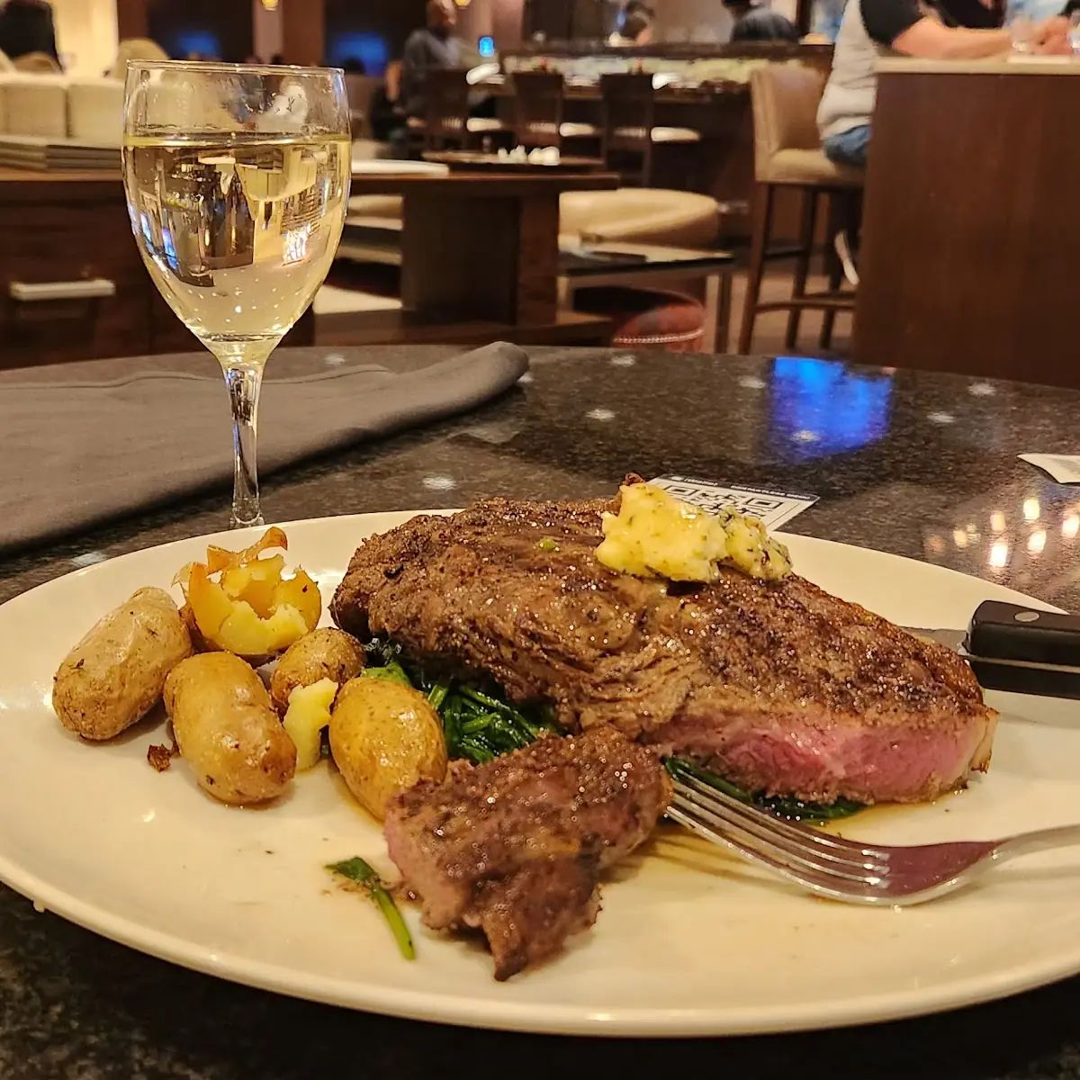 Ribeye Steak with Mini Baked Potatoes and Sautéed Spinach