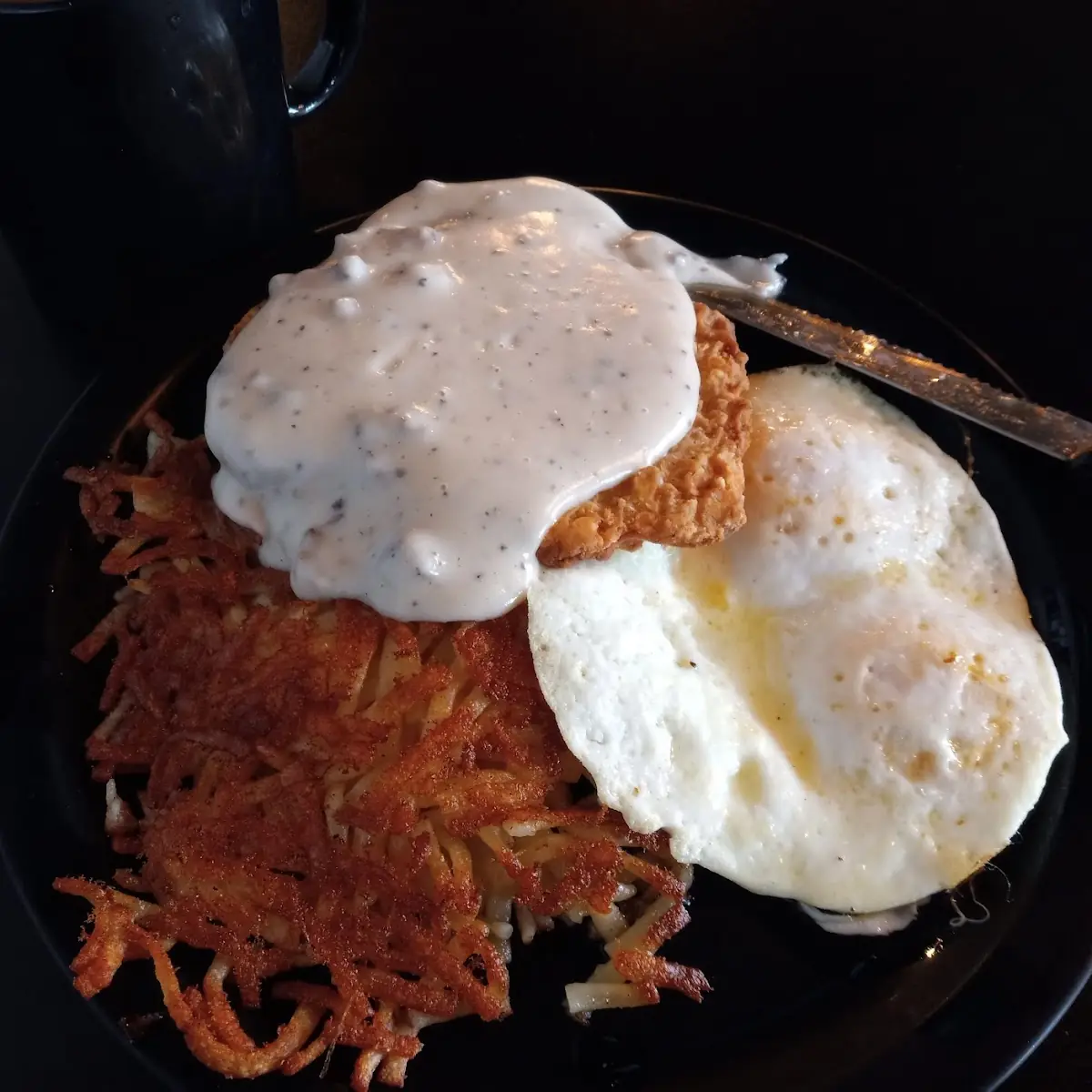 Eggs over Easy Chicken Fried Steak Sausage Gravy Hash Browns