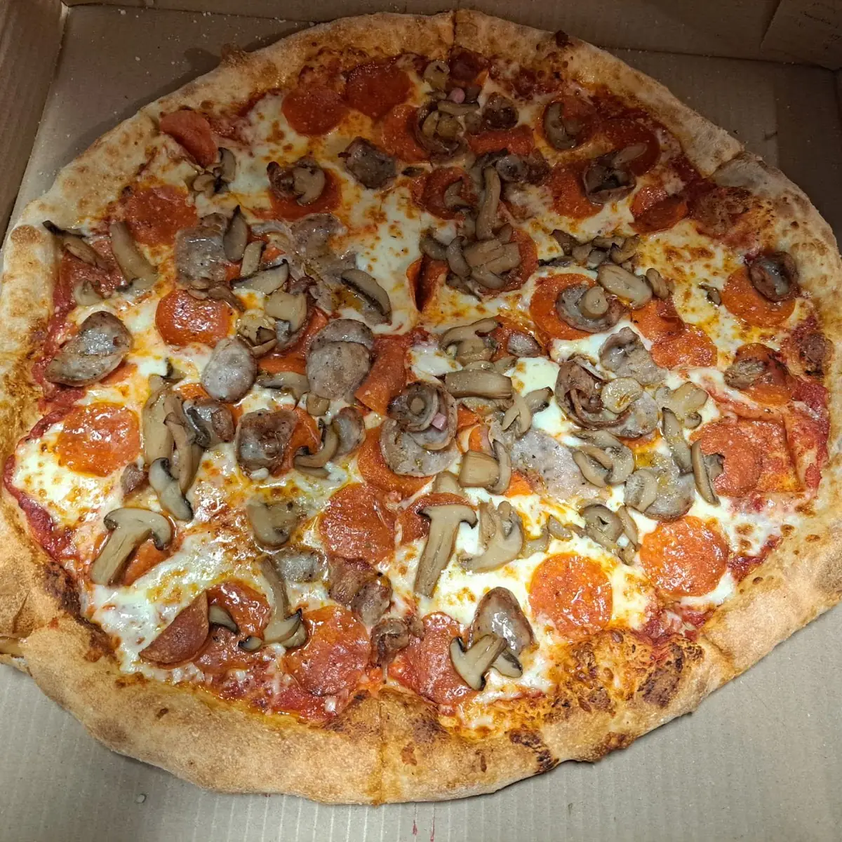 Pepperoni and Mushroom Pizza in Box