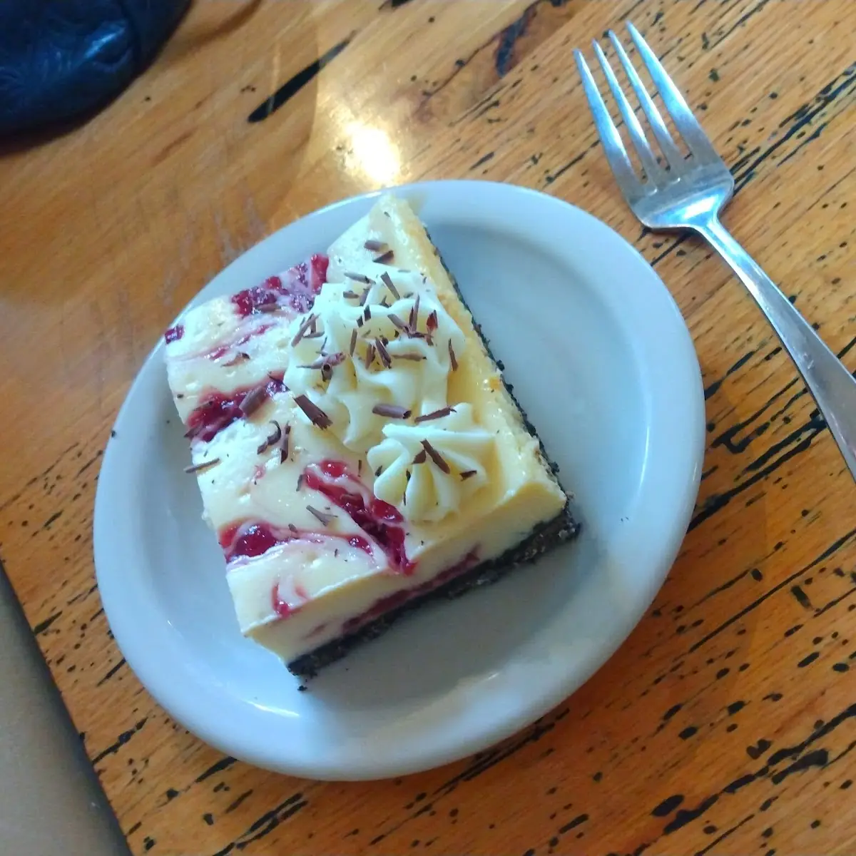 White Chocolate Raspberry Oreo Cheesecake Slice