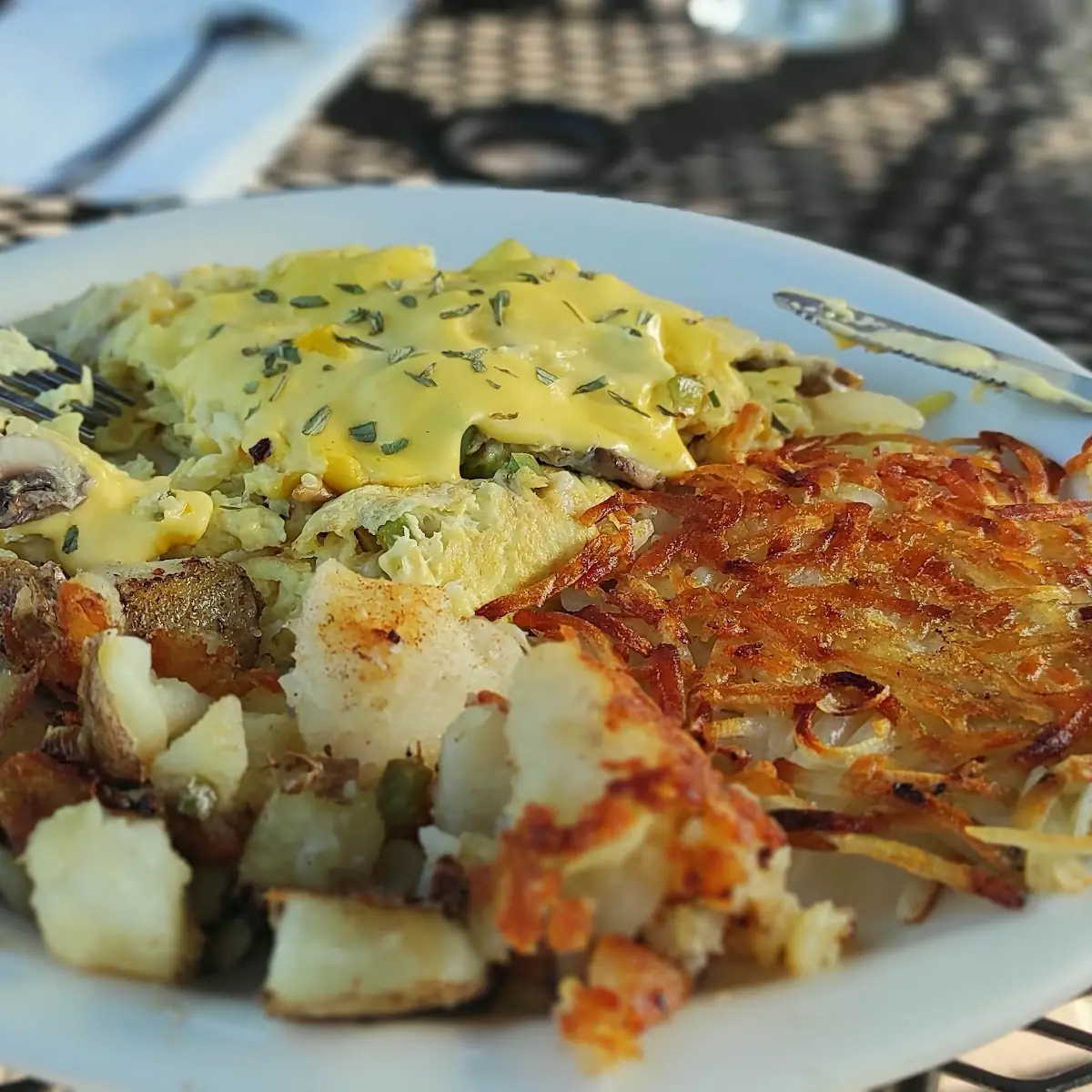 Stack Stack Hash Browns Bacon Eggs Gravy in the Back Eggs Benedict