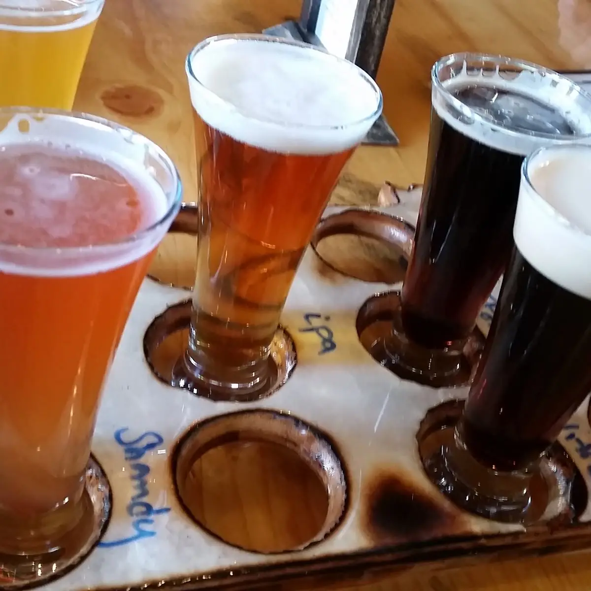Craft Beer Flight on Wooden Table