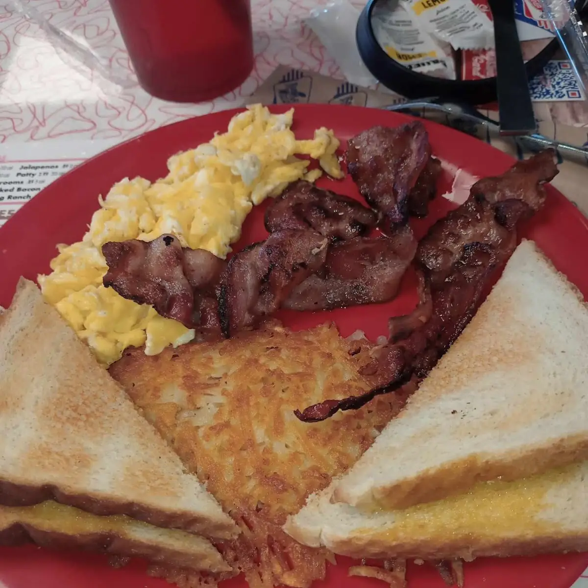 Scrambled Eggs Hash Browns Bacon and Toast