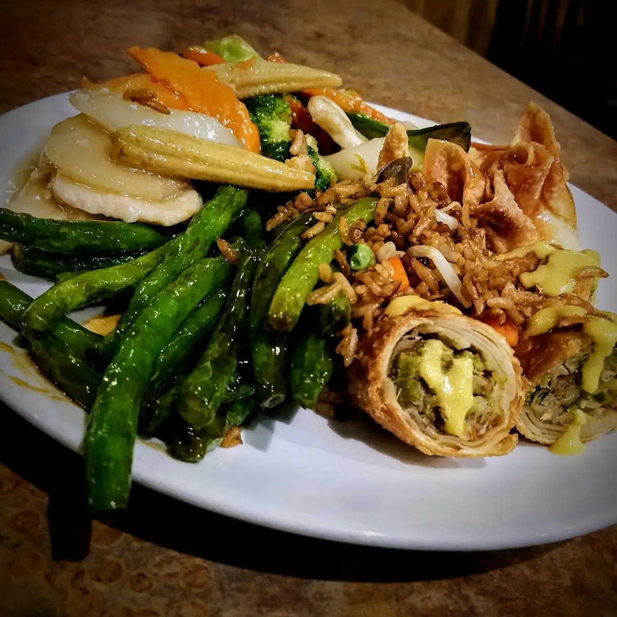 Buffet Plate with Spring Rolls Green Beans and Chicken