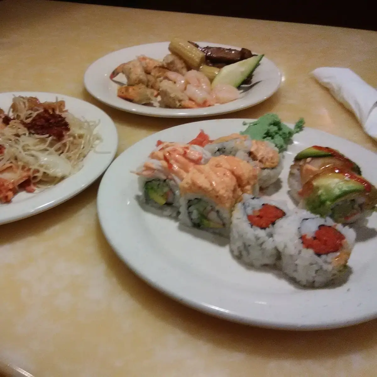 Buffet Items Including Sushi Rolls