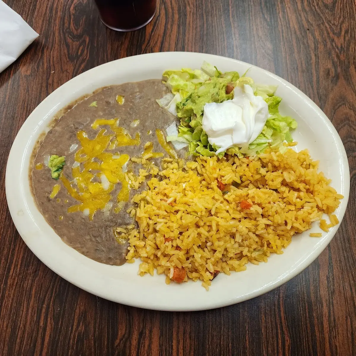 Rice Beans Sour Cream Lettuce and Guacamole